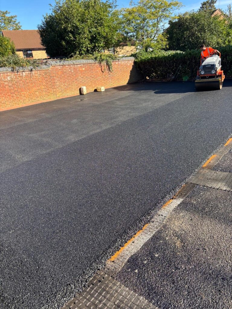 120 roller pounding it in on this car park resurfacing project