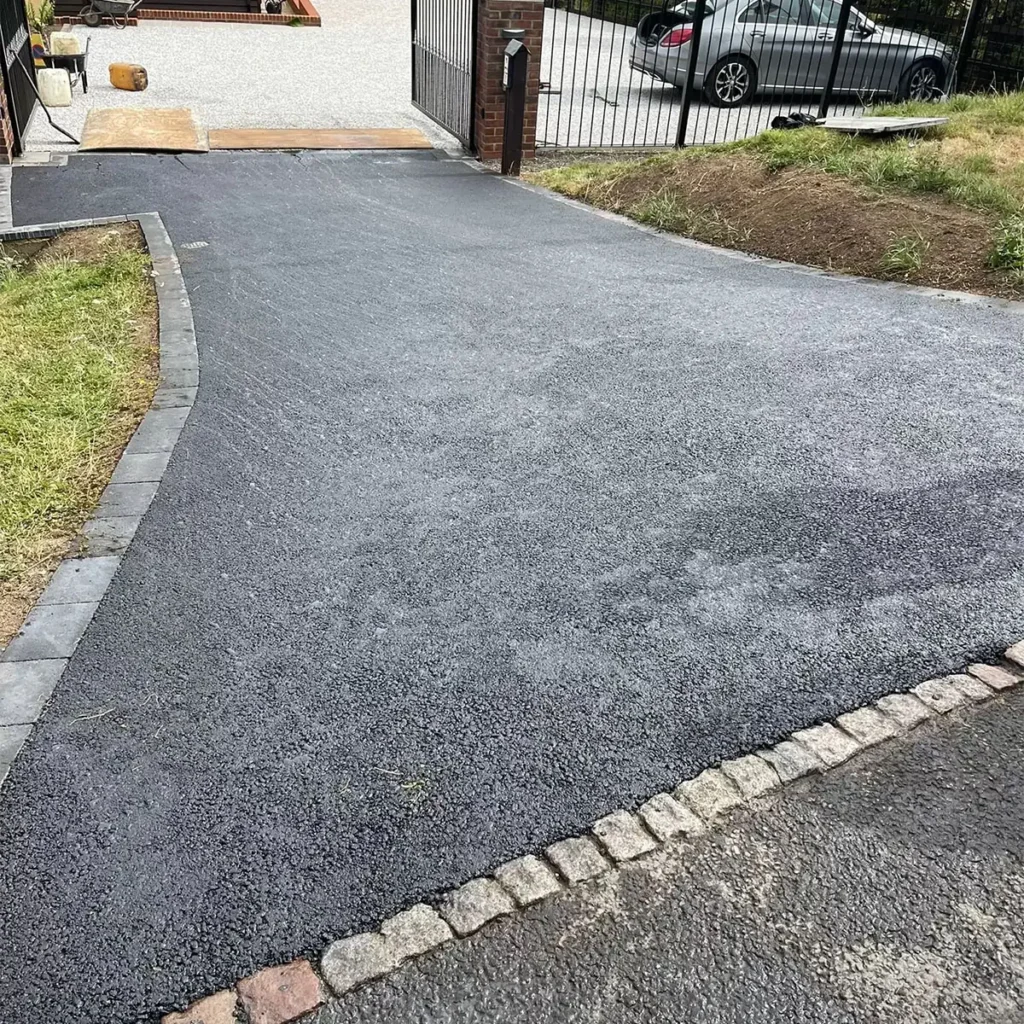 New tarmac driveway with sett edging